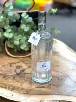 بطری شیشه‌ای شفاف دومان با درب لاکی پیچی و ظرفیت ۱.۵ لیتر